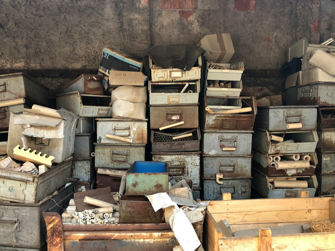 Rows of archive folders and filing cabinets with public records